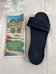 A pair of slippers and a paperAI-generated content may be incorrect.